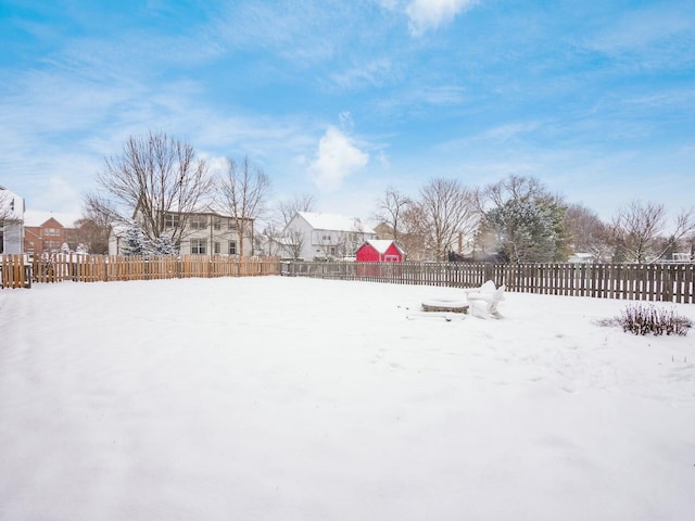 view of yard layered in snow