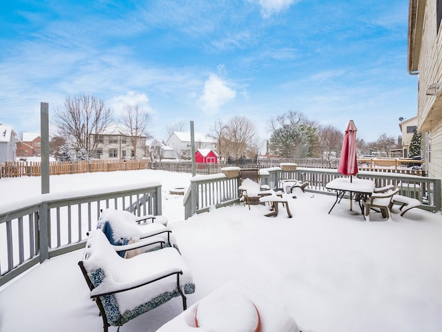 view of snow covered deck