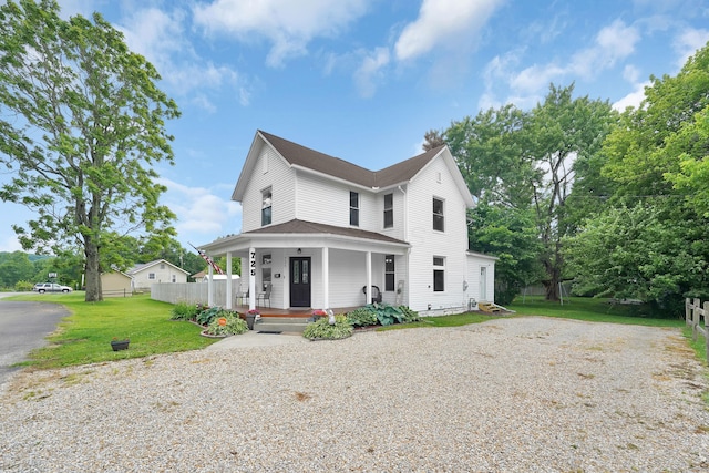 view of front facade with a porch and a front lawn