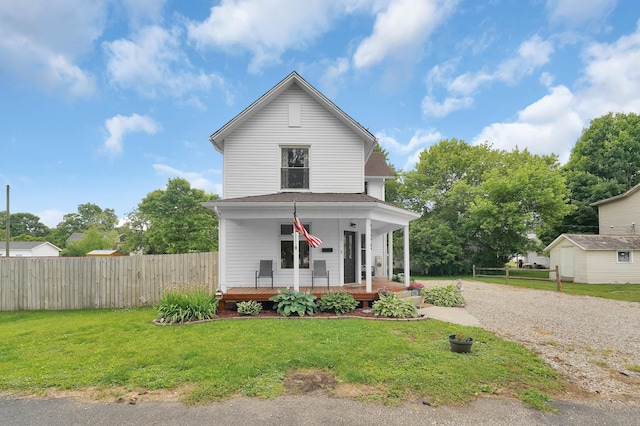 view of front facade with a front lawn and a porch