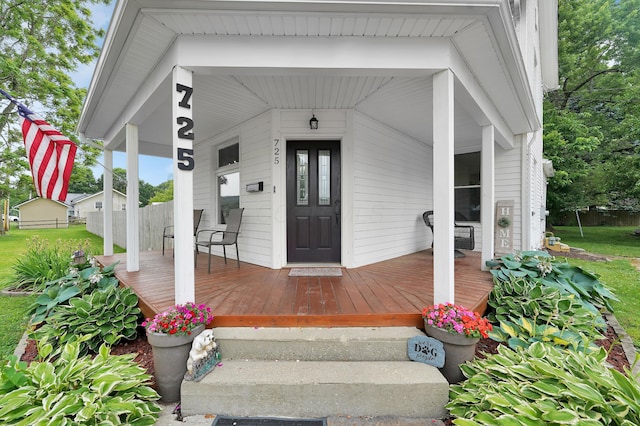 doorway to property featuring covered porch