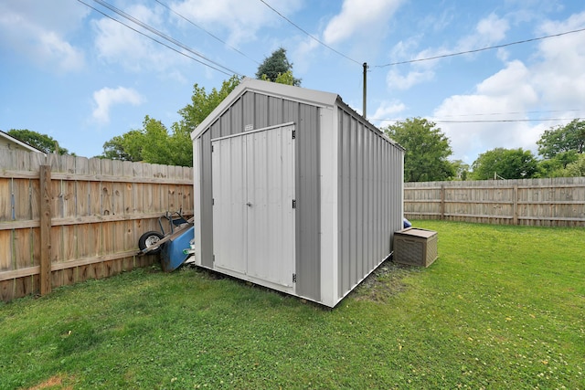 view of outdoor structure with a lawn