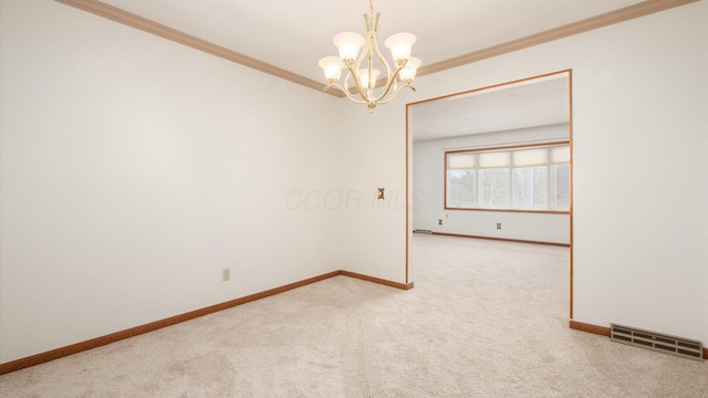 carpeted spare room with crown molding and a notable chandelier