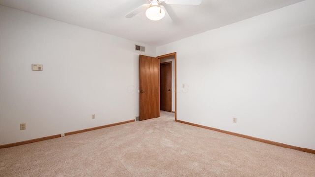 carpeted empty room with ceiling fan