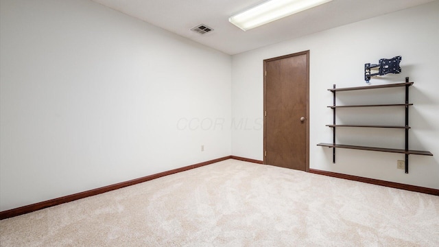 unfurnished room featuring carpet