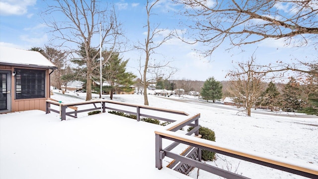 view of yard layered in snow