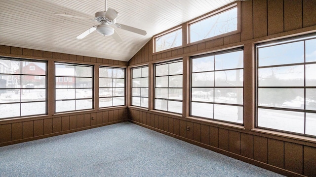 unfurnished sunroom featuring vaulted ceiling and ceiling fan