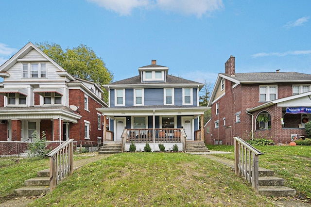 view of front of house with a porch and a front lawn