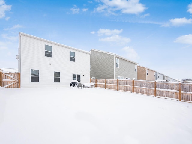 view of snow covered house