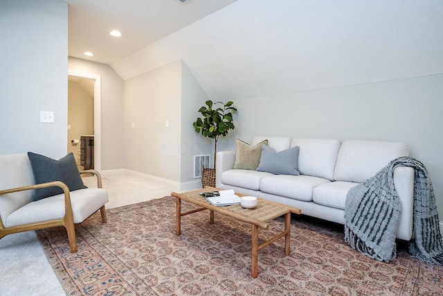 living room featuring vaulted ceiling