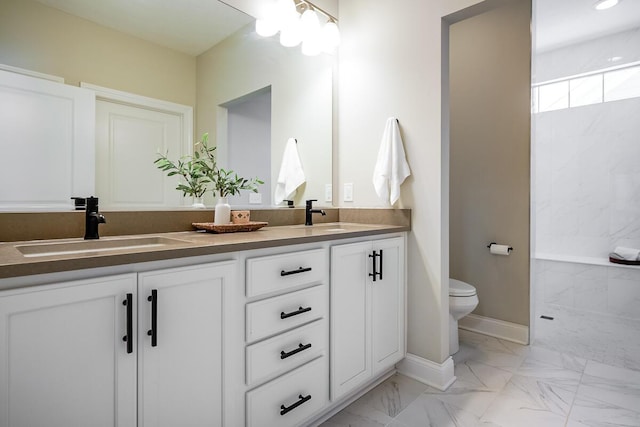 bathroom featuring a shower, vanity, and toilet