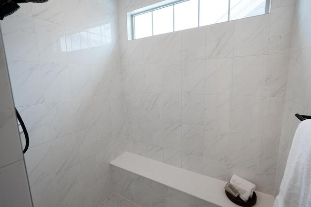 bathroom featuring tiled shower