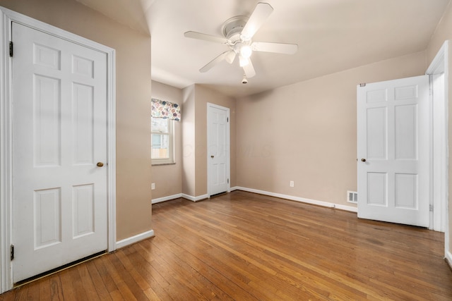 unfurnished bedroom featuring ceiling fan and light wood-type flooring