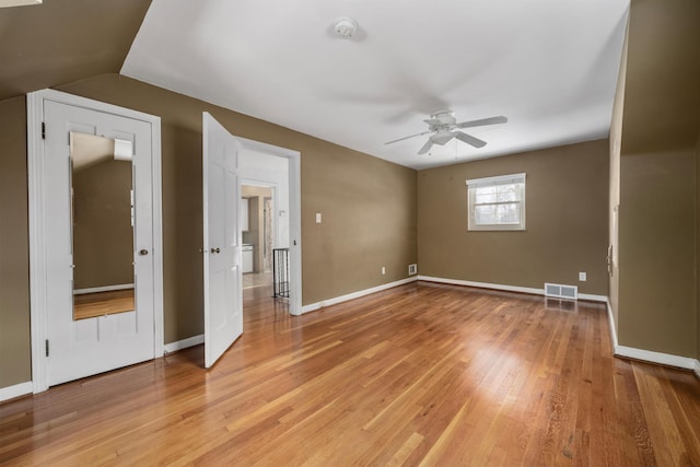 unfurnished bedroom with light hardwood / wood-style flooring, ceiling fan, and lofted ceiling