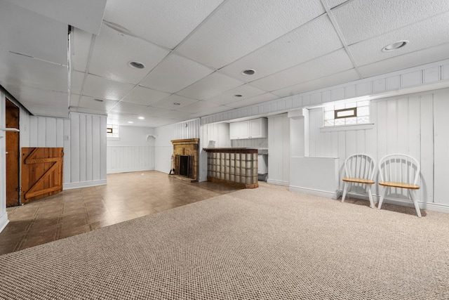 basement featuring a drop ceiling