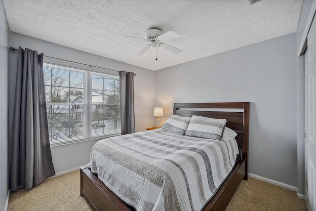 bedroom with light carpet, a closet, and ceiling fan