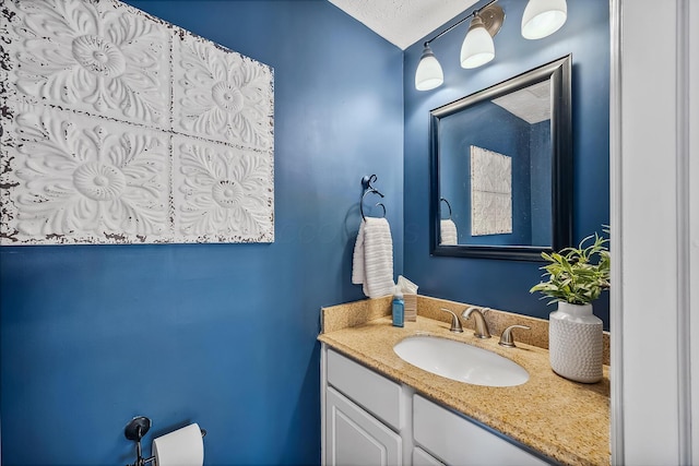 bathroom featuring vanity and a textured ceiling