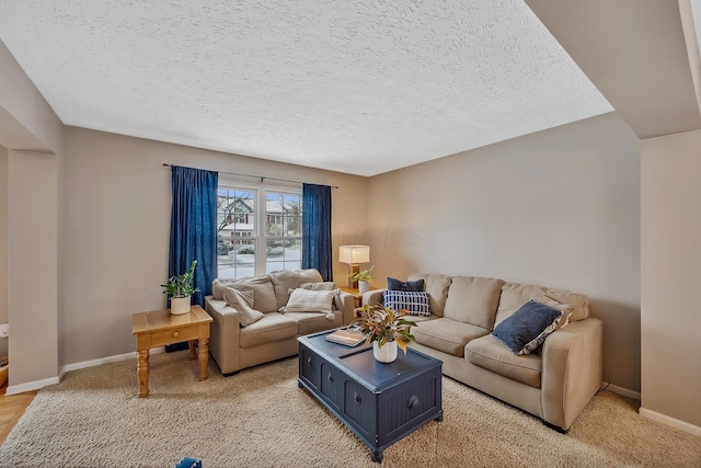 carpeted living room featuring a textured ceiling