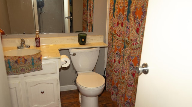 bathroom featuring hardwood / wood-style floors, vanity, and toilet