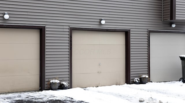 view of snow covered garage