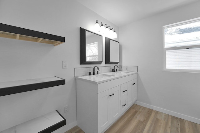 bathroom featuring hardwood / wood-style floors, vanity, and a wealth of natural light