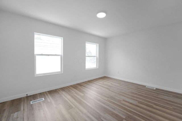 empty room with wood-type flooring