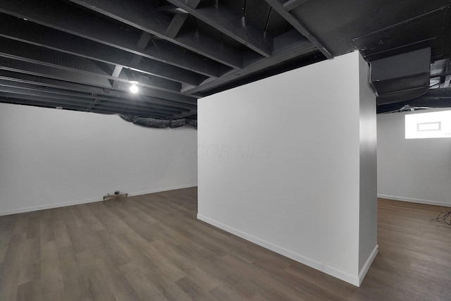 basement featuring hardwood / wood-style flooring