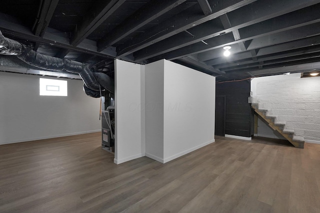 basement featuring wood-type flooring