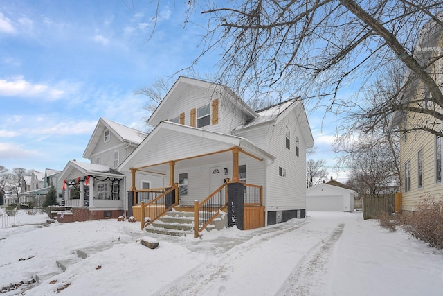 view of front of home featuring an outdoor structure, a porch, and a garage