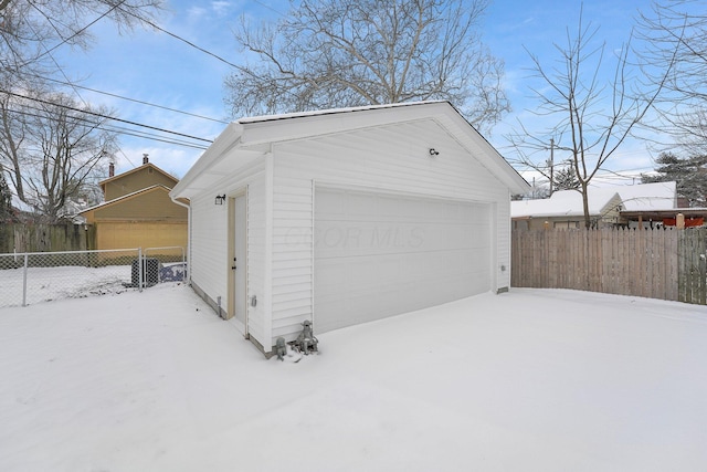 view of snow covered garage