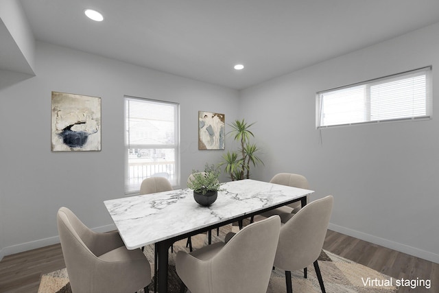 dining space with dark hardwood / wood-style floors