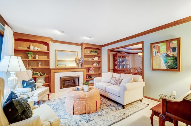 living room featuring built in features and crown molding