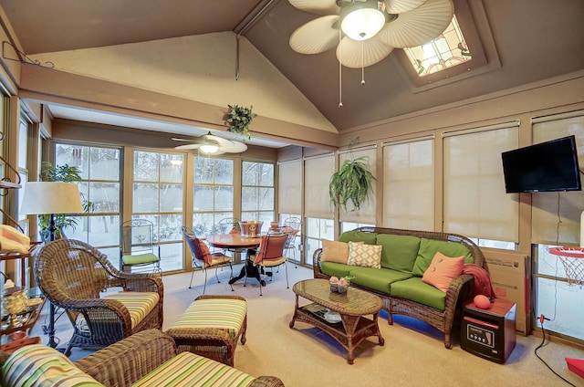 sunroom with ceiling fan and lofted ceiling