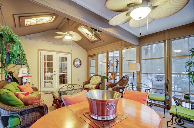 dining space featuring ceiling fan, french doors, and lofted ceiling with beams