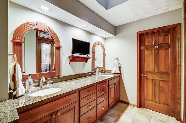 bathroom featuring tile patterned floors and vanity