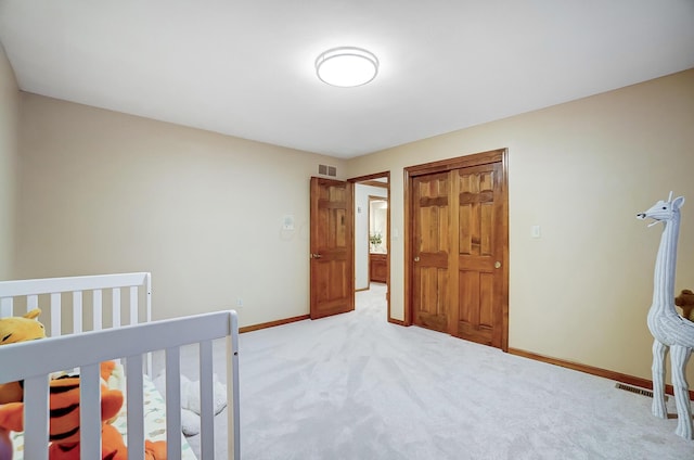 unfurnished bedroom featuring light colored carpet