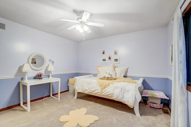 bedroom with light colored carpet and ceiling fan