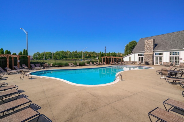 view of pool featuring a patio