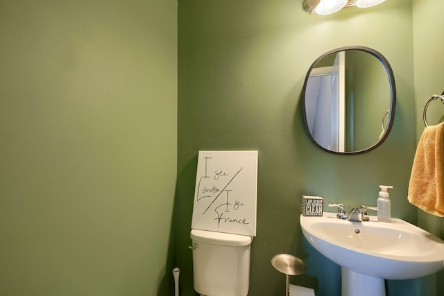 bathroom with toilet and sink