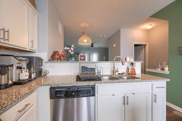 kitchen with white cabinetry, dishwasher, sink, kitchen peninsula, and decorative backsplash