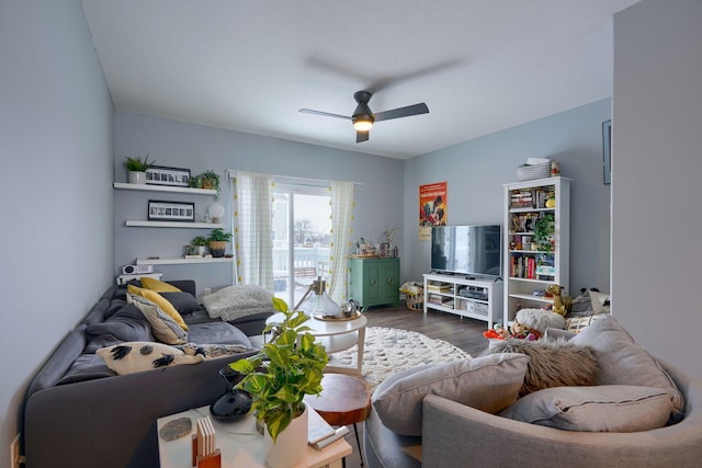 living room with ceiling fan and dark hardwood / wood-style flooring