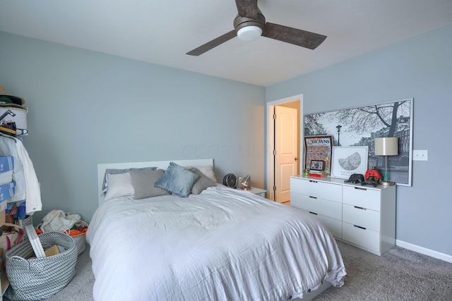 bedroom featuring ceiling fan and carpet