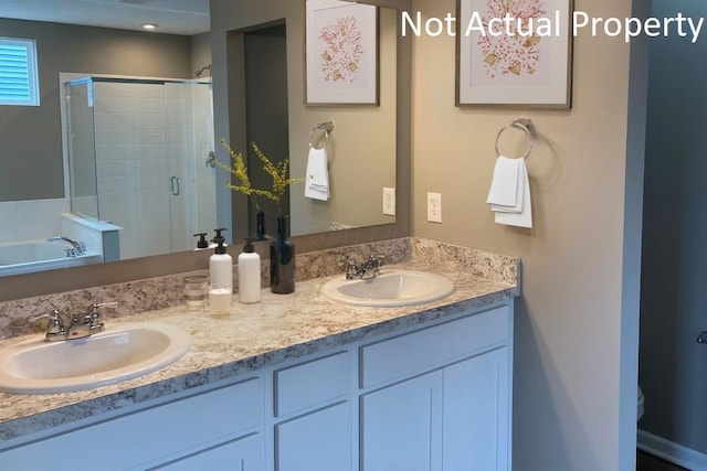 bathroom featuring vanity and separate shower and tub