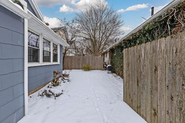 view of yard layered in snow