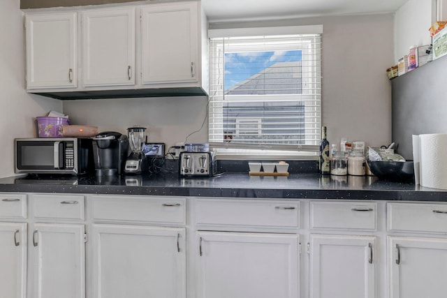 kitchen with white cabinets