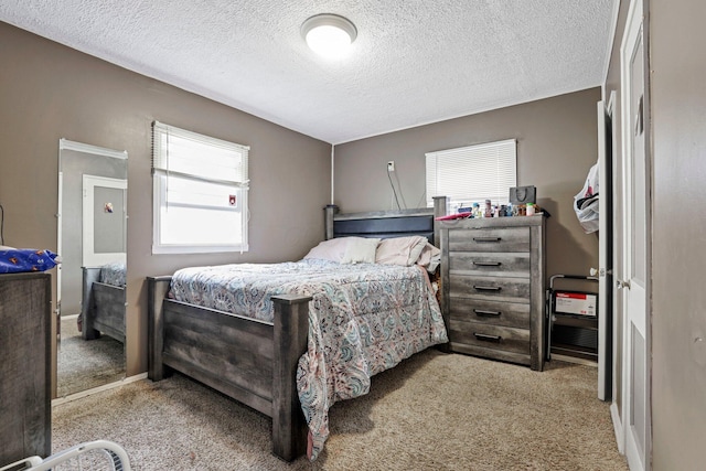 carpeted bedroom with a textured ceiling