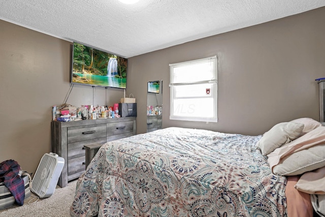 carpeted bedroom with a textured ceiling