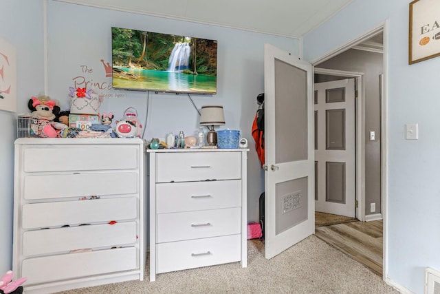 unfurnished bedroom featuring light colored carpet and ornamental molding