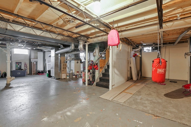 basement with a wealth of natural light and heating unit