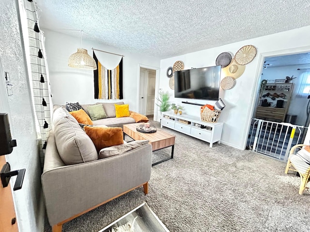 carpeted living room featuring a textured ceiling